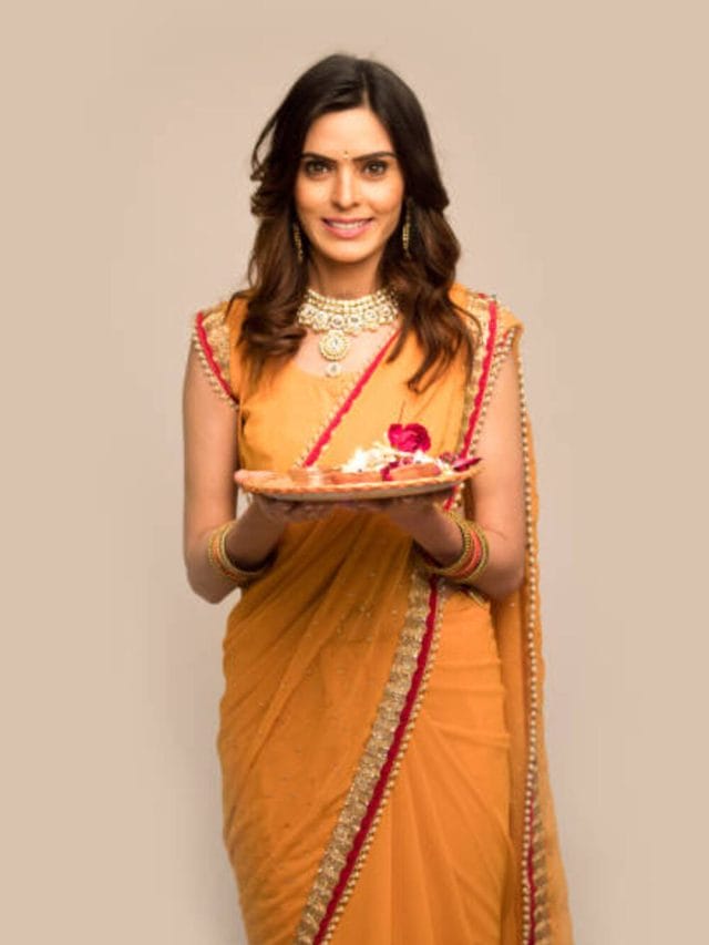 Woman holding plate of religious offering