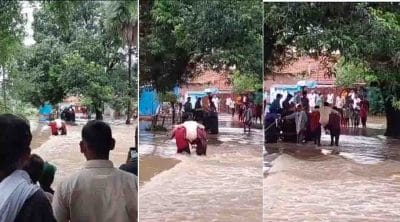 जोखिम में जान ! तेज बारिश के बीच उफनते नाले पर रस्सियों से लटककर दूल्हा-दुल्हन समेत ऐसे पार कर गई बारात, वीडियो वायरल