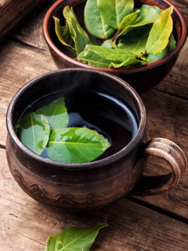 Herbal tea with bay leaf on wooden background.Slimming tea