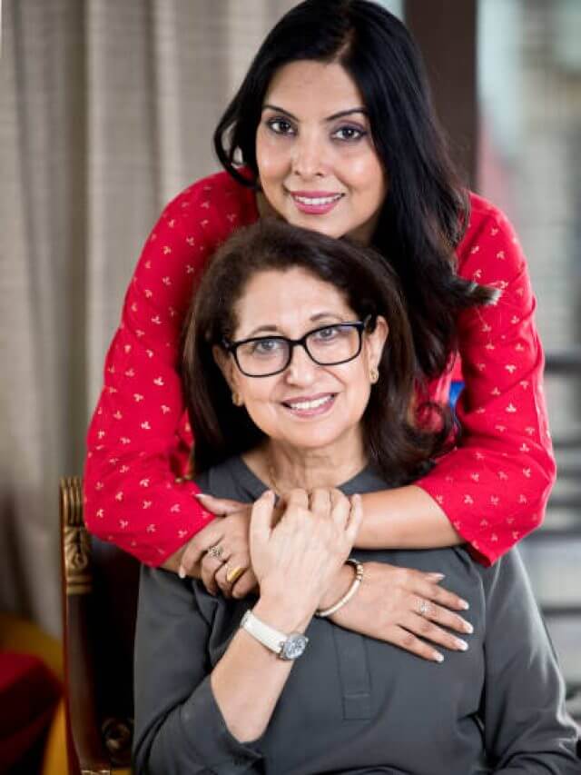 Portrait of happy woman embracing her senior mother with love