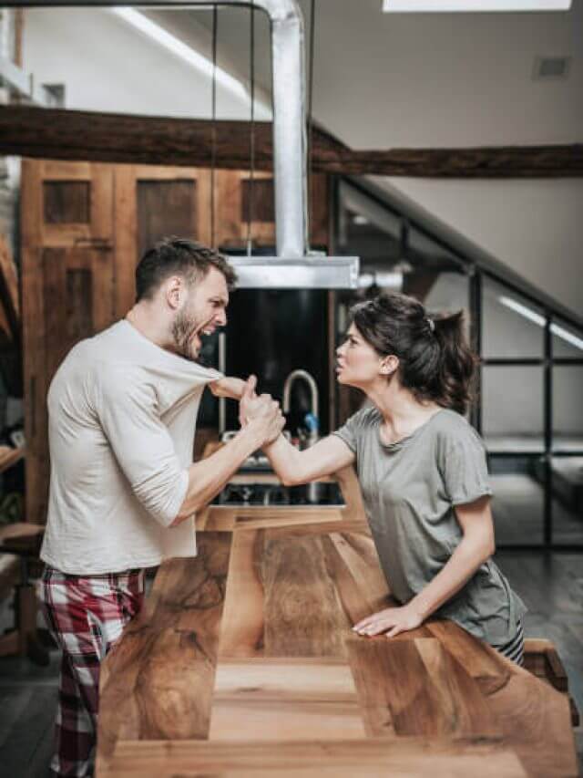 Aggressive couple arguing about their problems at home.