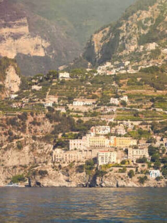 View from a boat on a small town in the mountains on the Amalfi coast