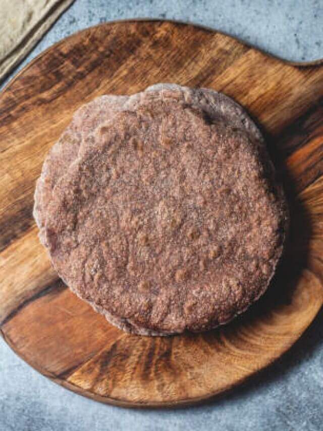 healthy super food "ragi roti" with raw ragi and flour. selective focus.