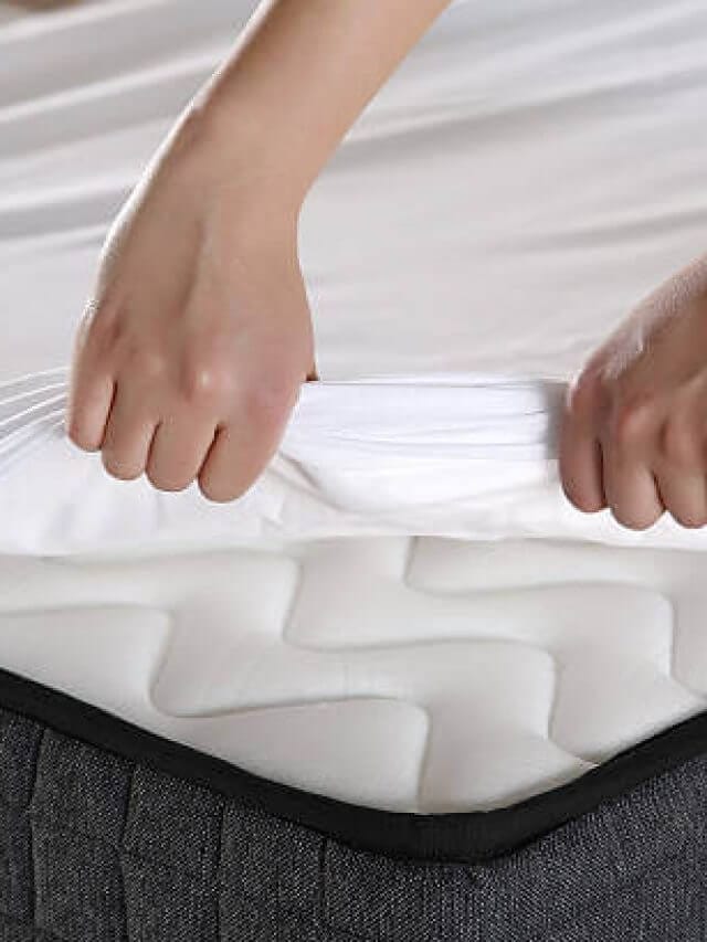 Female hand pulling white sheets