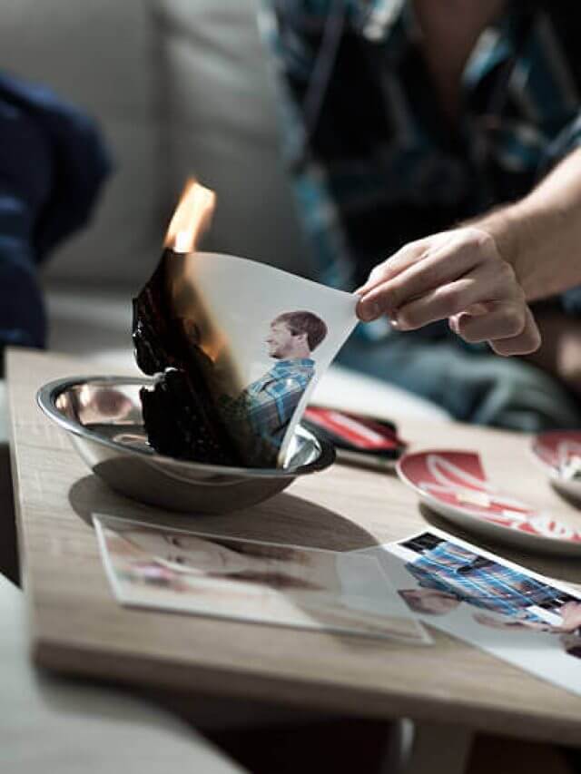 Man burning photo with ex-girlfriend after split up
